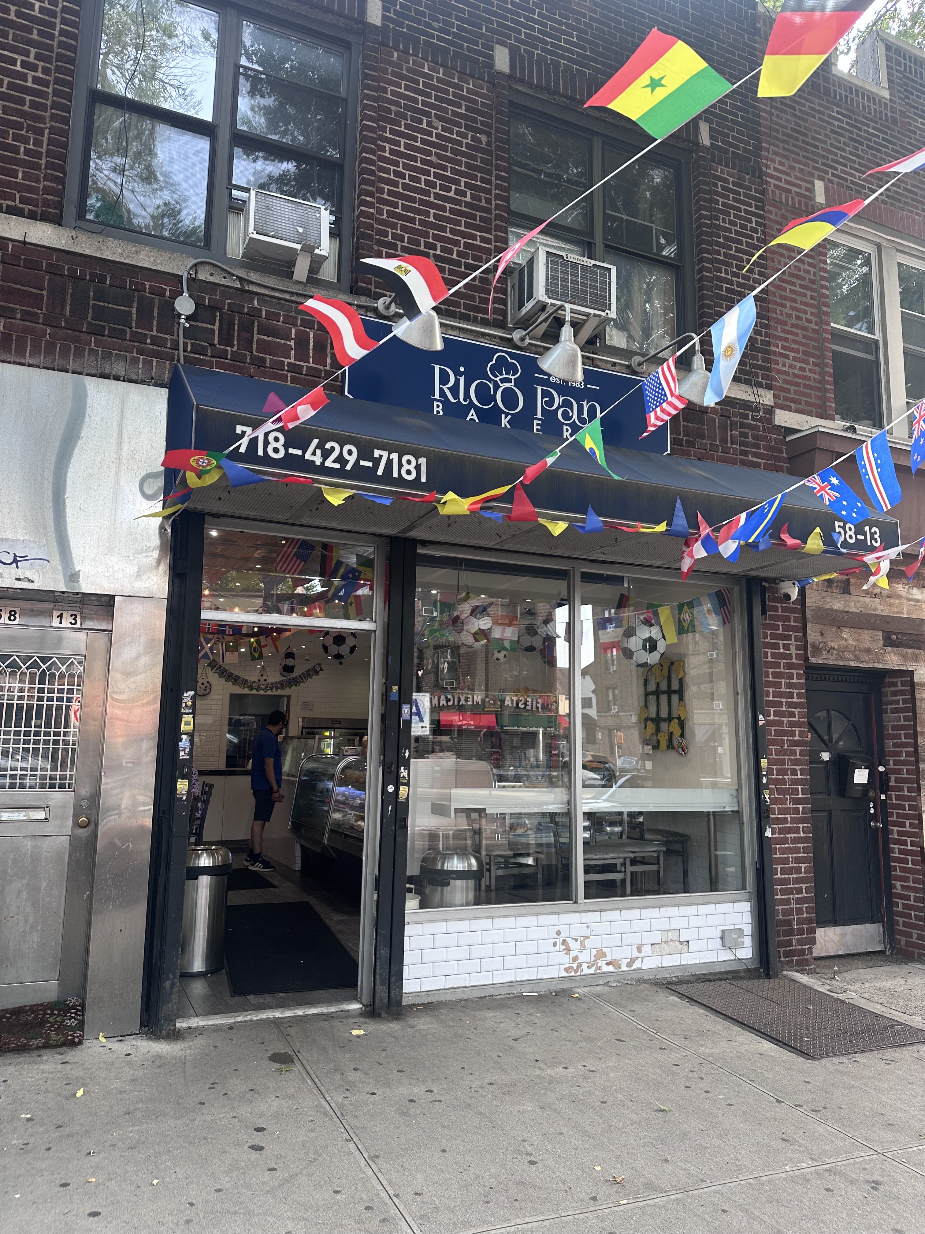 Storefront of Rico Pan Bakery in Woodside Queens