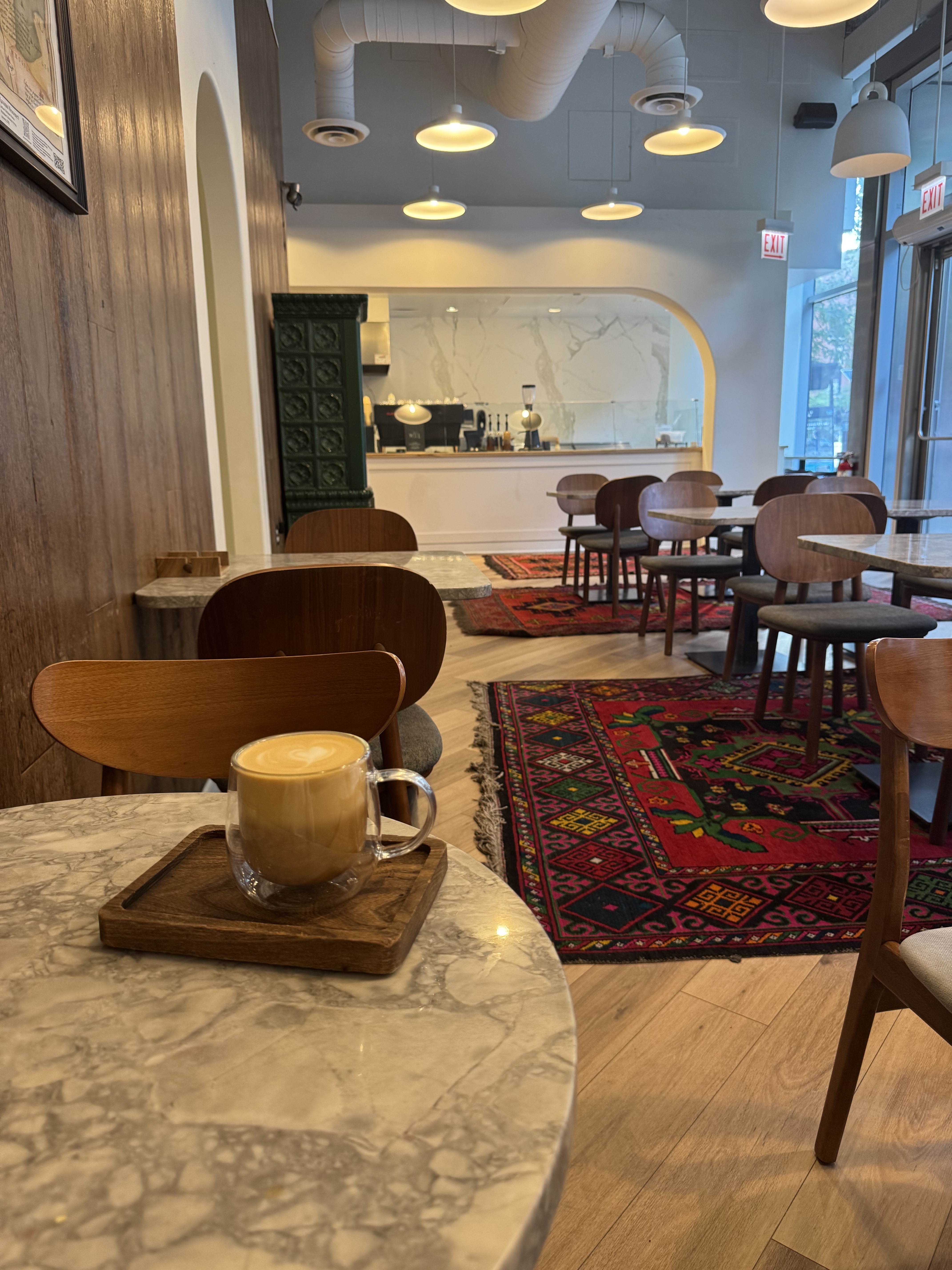 Latte on a marble table inside Tary café Chicago