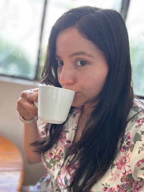 Diana drinking a cappuccino at Café Carmín in Cholula