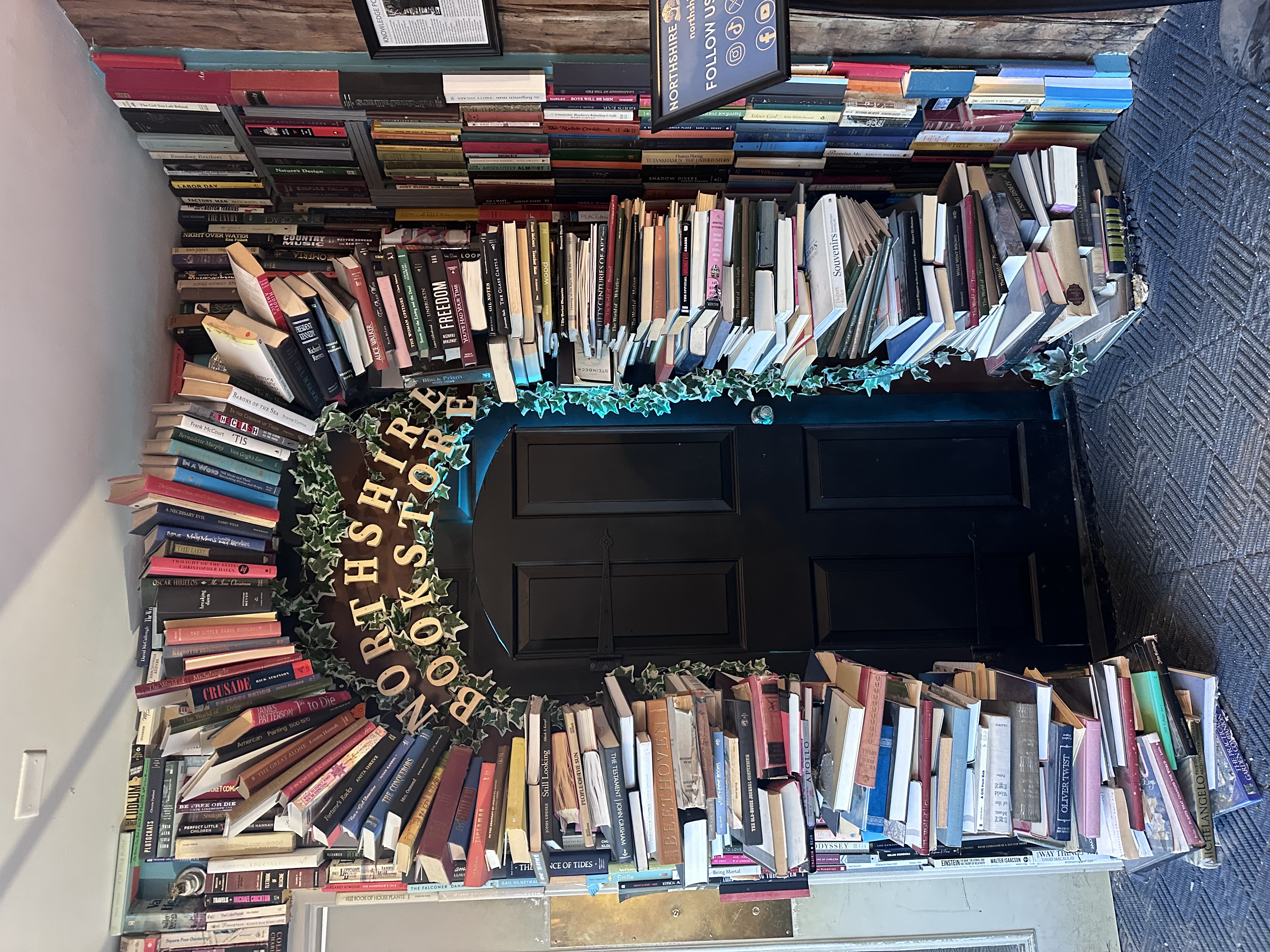 Iconic Northshire Bookstore entrance with books surrounding the door in Manchester Vermont