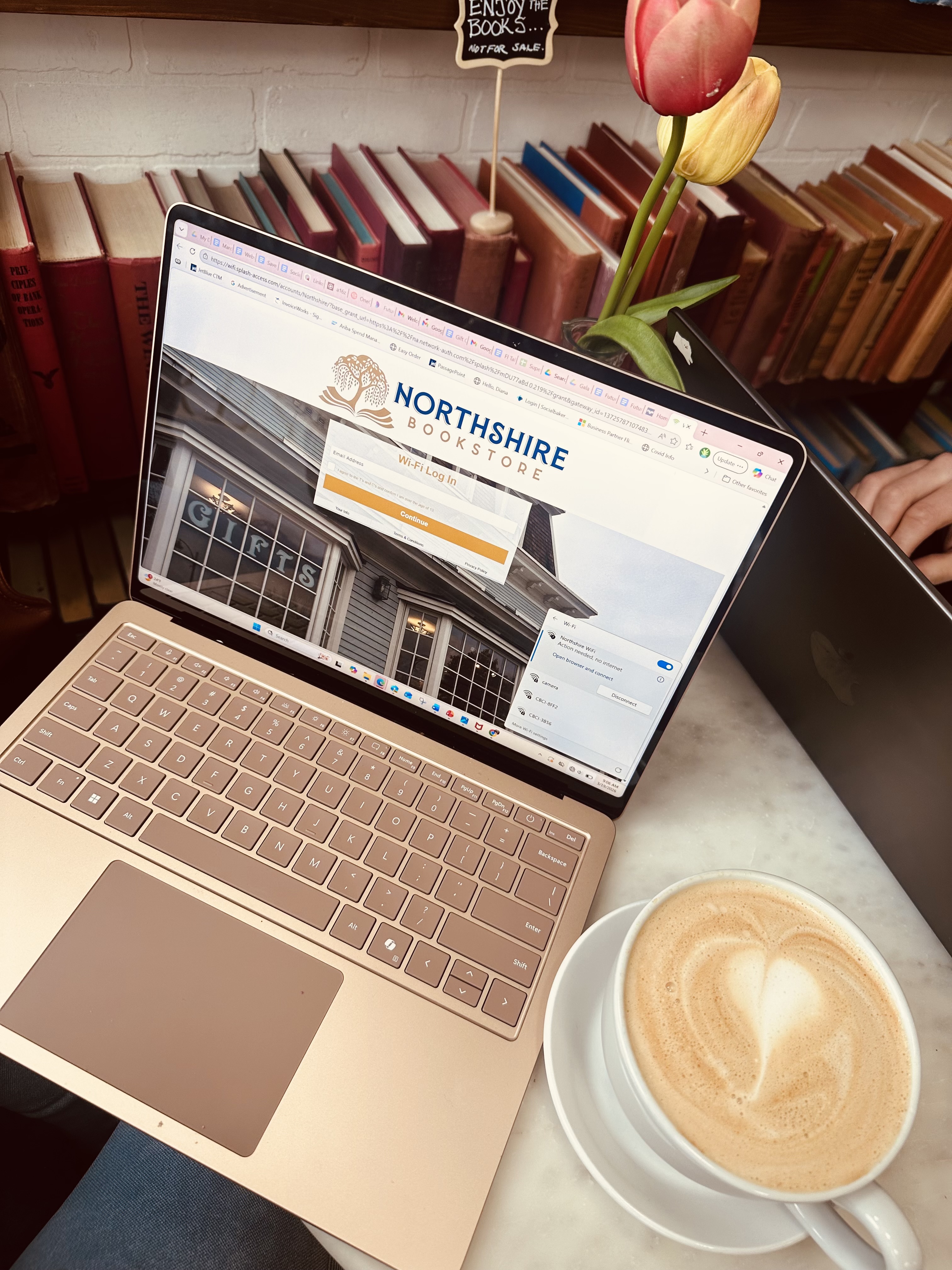 Latte and laptop at Colburn Cafe inside Northshire Bookstore Manchester Vermont